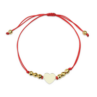 Bransoletka złota na sznurku Au 585 - serce