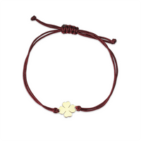 Bransoletka złota na sznurku Au 585 - koniczynka